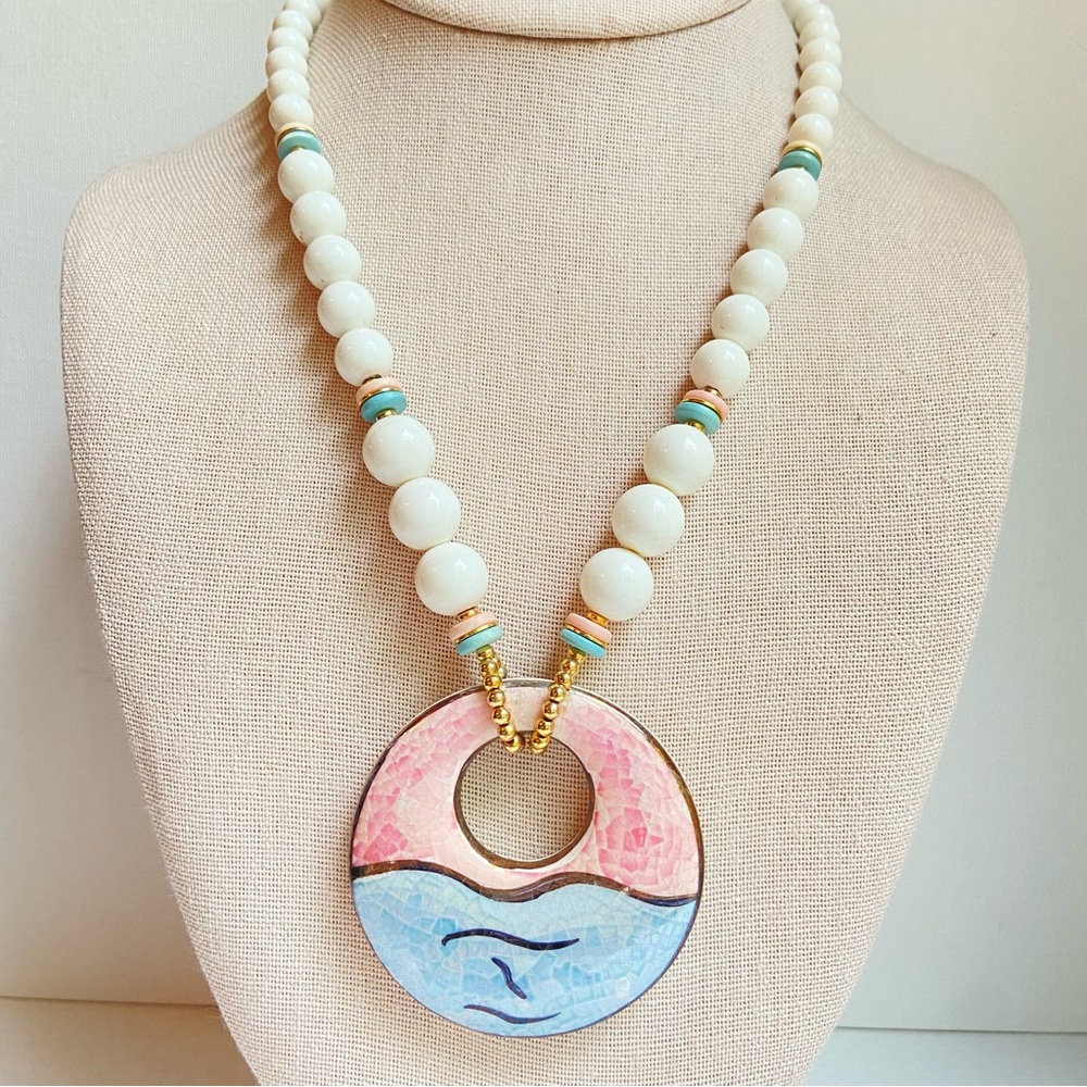 Ceramic pendant in pink blue on graduated white acrylic beads goldtone accents